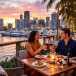 Couple enjoying dinner at a stylish waterfront restaurant in Miami at sunset