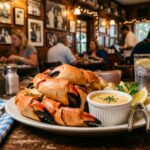 Fresh stone crab claws served at a historic Miami seafood restaurant with signature dipping sauce
